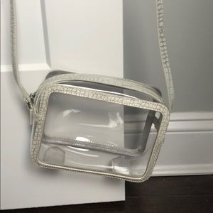 Transparent bag with snake print embossed details